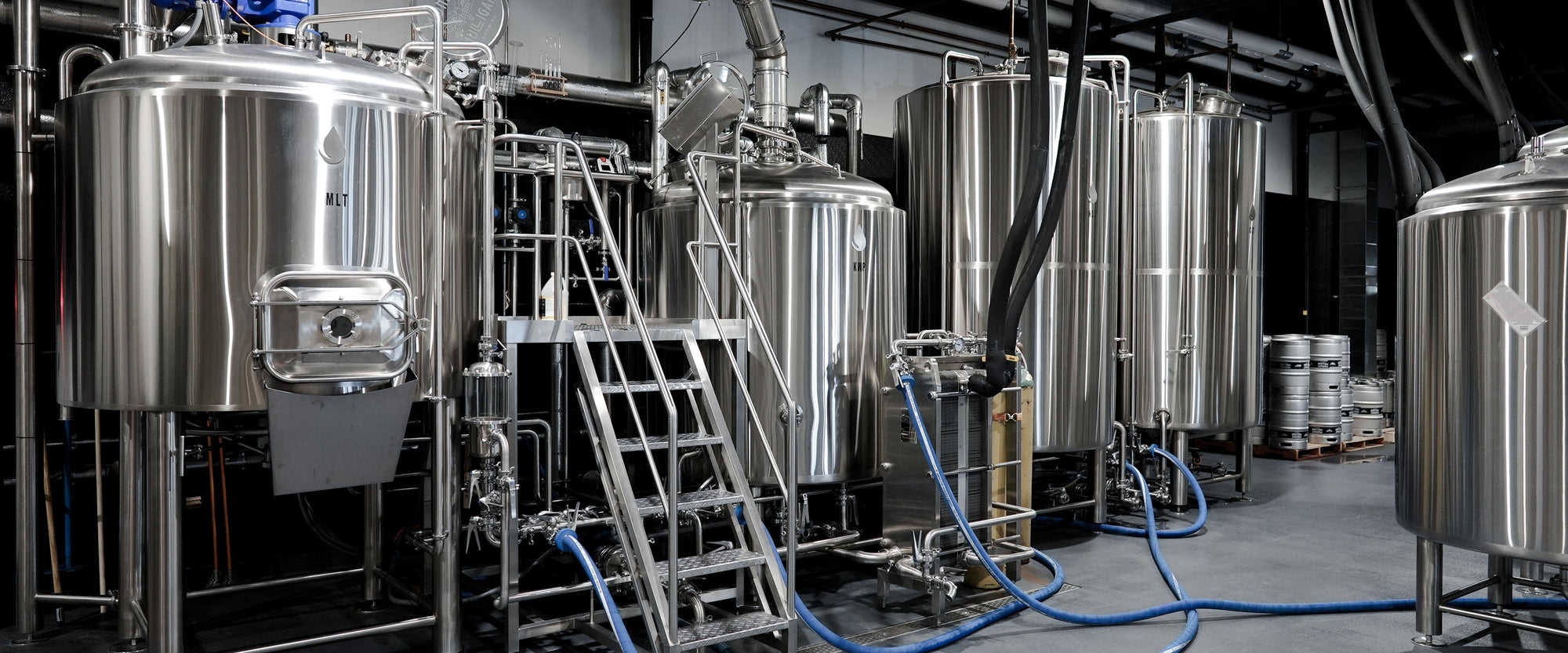 Midnight Mulligan Brewery showcasing 1.5" tri-clamp butterfly valves, brewhouse parts, sanitary fittings, and an array of brewing accessories. Discover top-quality brewing parts and equipment for your craft beer production."